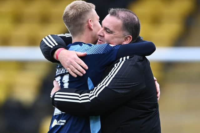 Hamilton academy graduate and matchwinner Kyle Munro celebrates with academy head coach, George Cairns after the win over Livingston. Picture: Paul Devlin / SNS