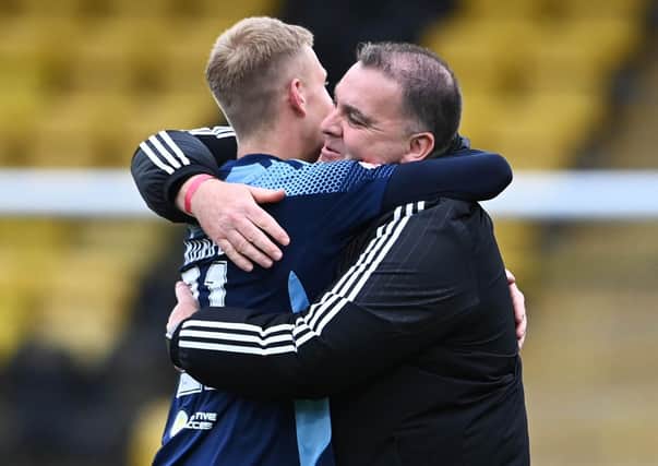 Hamilton academy graduate and matchwinner Kyle Munro celebrates with academy head coach, George Cairns after the win over Livingston. Picture: Paul Devlin / SNS