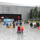 A socially distanced audience takes in a pop-up performance by Scottish Opera in Govan (Picture: John Devlin)