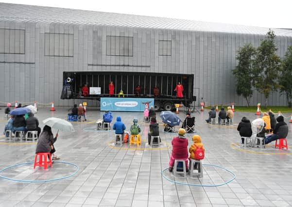 A socially distanced audience takes in a pop-up performance by Scottish Opera in Govan (Picture: John Devlin)