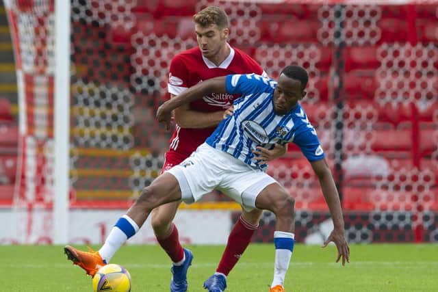 Tommie Hoban of Aberdeen keeps an eye on Kilmarnock's Nicke Kabamba. Picture: Ross MacDonald/SNS