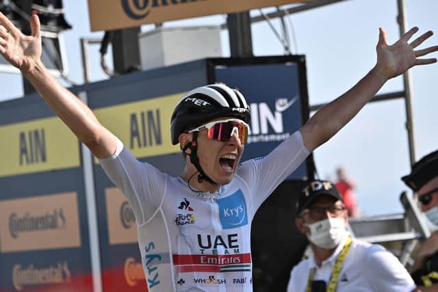 Tadej Pogacar of Slovenia celebrates yesterday as he crosses the finish line at the 15th stage of the Tour de France. Picture: AFP/Getty