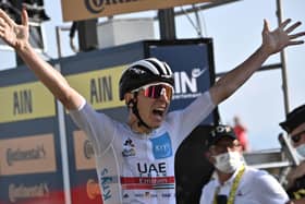 Tadej Pogacar of Slovenia celebrates yesterday as he crosses the finish line at the 15th stage of the Tour de France. Picture: AFP/Getty