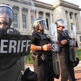 Police stand guard in front of the Kenosha County Courthouse during a second day of unrest on August 24, 2020 in Kenosha, Wisconsin.
