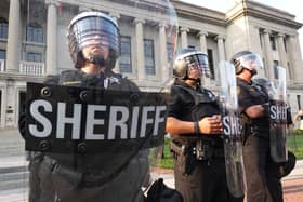 Police stand guard in front of the Kenosha County Courthouse during a second day of unrest on August 24, 2020 in Kenosha, Wisconsin.