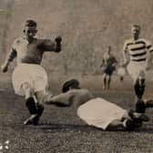 John Thomson dives at the feet of Sam English at Ibrox in 1931, with horrific consequences.