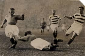 John Thomson dives at the feet of Sam English at Ibrox in 1931, with horrific consequences.
