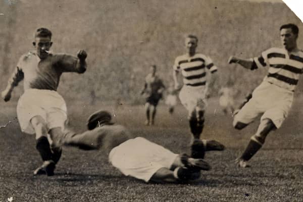 John Thomson dives at the feet of Sam English at Ibrox in 1931, with horrific consequences.