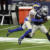 Dallas Cowboys wide receiver Michael Gallup (No 13) makes a catch but is called for offensive pass interference on Los Angeles Rams cornerback Jalen Ramsey. Picture: Jae C. Hong