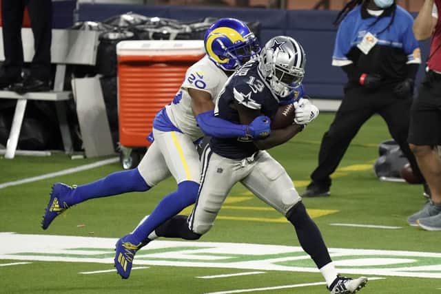 Dallas Cowboys wide receiver Michael Gallup (No 13) makes a catch but is called for offensive pass interference on Los Angeles Rams cornerback Jalen Ramsey. Picture: Jae C. Hong