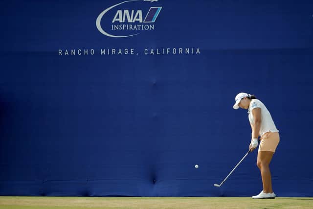 Mirim Lee plays her pitch to the 18th green after  using the blue wall as a backstop. Picture: Getty