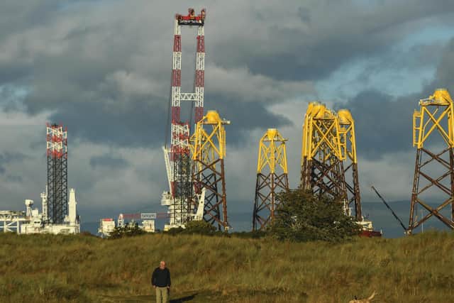 Foundations for an offshore wind farm float in The Cromarty Forth. Locals are accustomed to the sight of oil rigs moored up for maintenance, but moves to more renewables will transform the area, and the Scottish economy. Picture: Getty Images