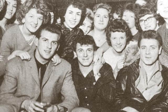 Eddie Cochran, right, meets fans on the UK tour with Gene Vincent, middle, and Vince Eager, who has written the book’s foreword