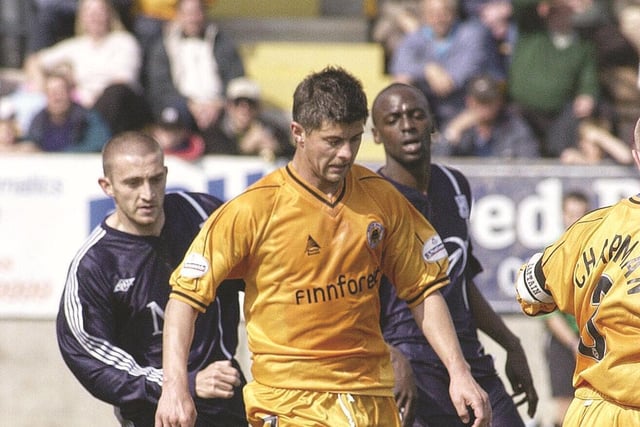 Tom Bennett gets away from ex-Pilgrim Mark Rawle.