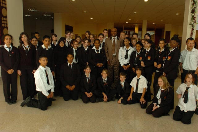 Former gold medal winning athlete Kriss Akabusi (centre) with Hereward Community College pupils before their last ever awards ceremony at Kingsgate.