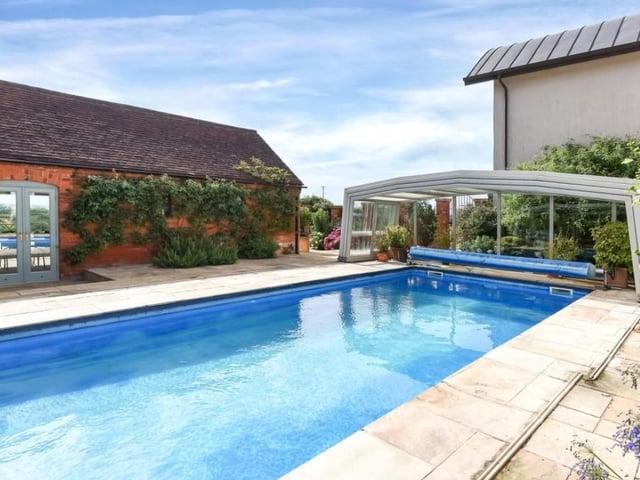 The covered swimming pool at Naseby Lodge is sheltered by surrounding buildings at the home