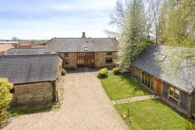 This home in Caldecote near Towcester is on the market for £1.3million with Savills, of Banbury. It is a Grade II listed stone barn conversion and includes a pony paddock and stable, as well as a gym and pool complex.