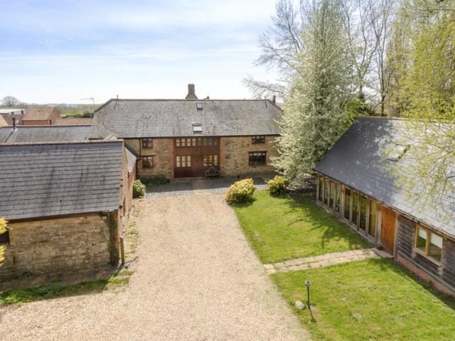This home in Caldecote near Towcester is on the market for £1.3million with Savills, of Banbury. It is a Grade II listed stone barn conversion and includes a pony paddock and stable, as well as a gym and pool complex.
