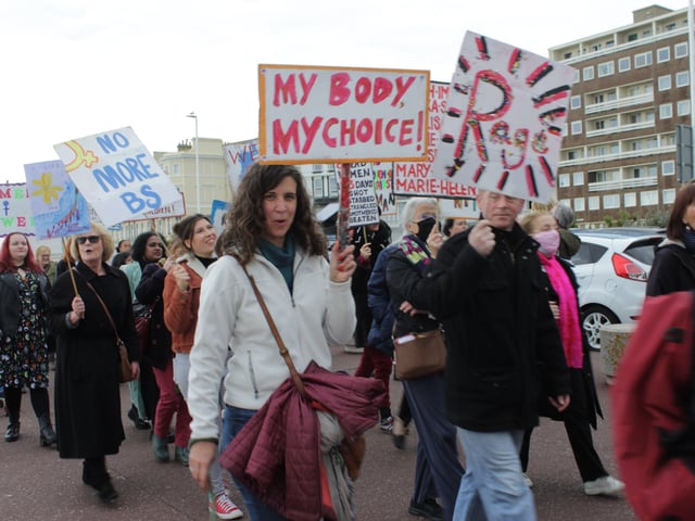 Women's Voice supporters march through the streets of Hastings SUS-211025-115202001