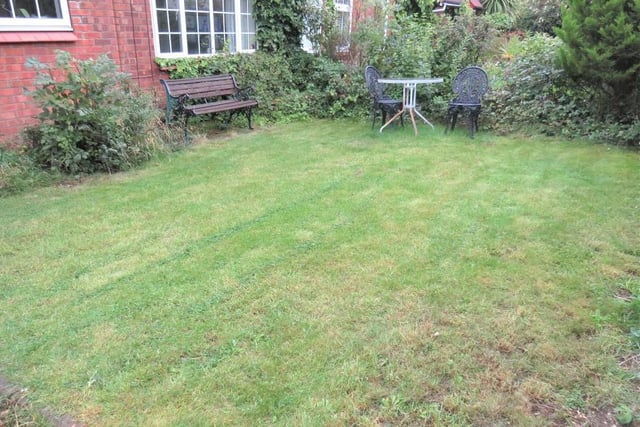 The garden is laid to lawn