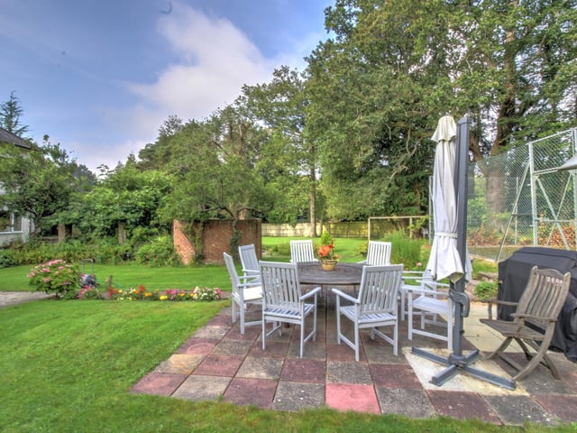 The grounds are mainly to the side and rear of the property and include a tennis court, which would benefit from some repair/maintenance and is fully enclosed with wire fencing.