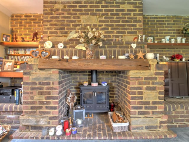 The wood burning stove in the large lounge