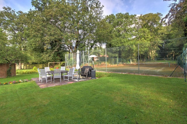 Approx 1.2 acres of garden which includes a tennis court