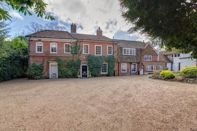 This detached home has an impressive ground floor with five reception rooms