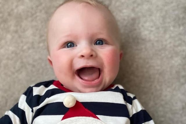 This smiley baby, Archie Austin Spencer, was born on 11 July, weighing seven pounds.