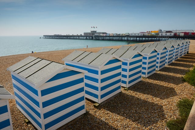 Hastings seafront pictured on September 6 last year during the mini heatwave.

Beach huts near Hastings pier. SUS-210609-132828001