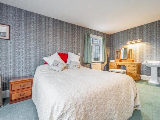 One of the five bedrooms.