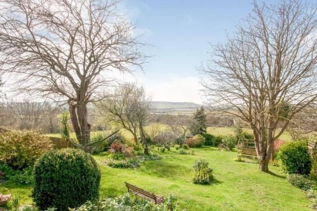 This beautiful cottage nestled at the foot of Mount Caburn is the most popular property in terms of page views this month, according to Zoopla. SUS-220203-145629001