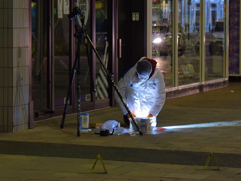 Police at the scene. Photo by Dan Jessup