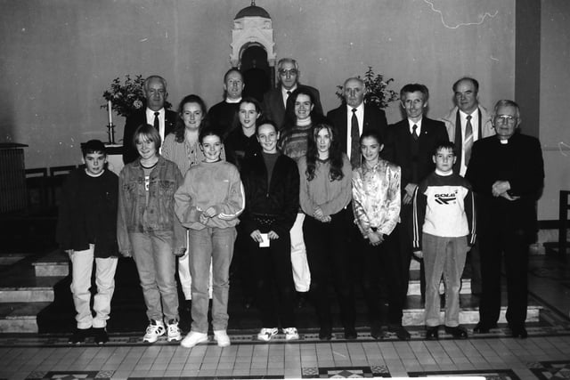 Committee members of the Carndonagh Pioneer Association with young people who received Junior Pins at a Mass in the Church of the Sacred Heart. Front, from left, are John Paul McDaid, Margaret Rose Porter, Mary Theresa Callaghan, Sarine Cantwell, Louise Cantwell, Denis Harkin and Fr. Colin Morris. Standing, at back, are Lorraine McLaughlin, Sarah Doherty, Andrea Porter, Denis Harkin, Full Pioneer, Owen Harkin, Pat Porter, Conal Taiff, Charlie Hegarty and Hugh McGeoghan.
