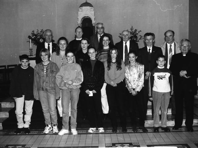 Committee members of the Carndonagh Pioneer Association with young people who received Junior Pins at a Mass in the Church of the Sacred Heart. Front, from left, are John Paul McDaid, Margaret Rose Porter, Mary Theresa Callaghan, Sarine Cantwell, Louise Cantwell, Denis Harkin and Fr. Colin Morris. Standing, at back, are Lorraine McLaughlin, Sarah Doherty, Andrea Porter, Denis Harkin, Full Pioneer, Owen Harkin, Pat Porter, Conal Taiff, Charlie Hegarty and Hugh McGeoghan.