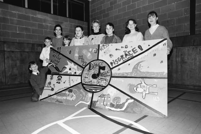 Young people from Caw Youth Club with a wall mural they painted at an art workshop at Columba House. Included, from left, Catriona Nic Mhuiris, Columba House, Joanne Walker, Youth Leader Y.C. and Michelle Walsh,Project Worker.