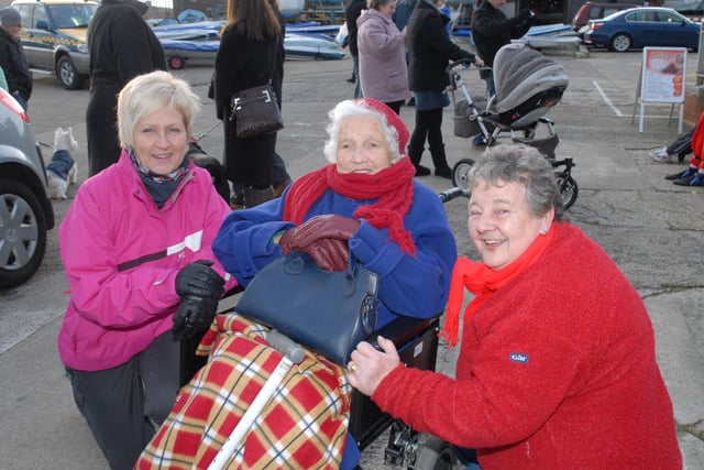 Gillian Dorman, Susan Johnston and Dorothy Thompson watching the New Year's Day swimmers at the East Antrim Boat Club.