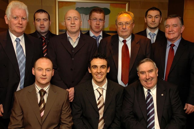 Ballinderry and Derry star Kevin McGuckin who was the special guest at Ogra Colmcille GFC presentation dinner dance in 2007 pictured with club officials.