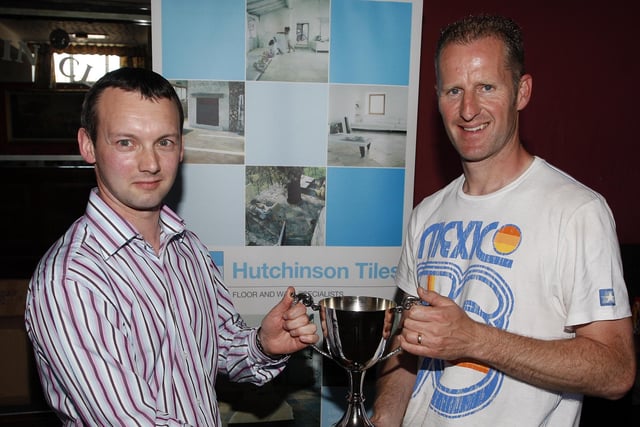 ALL YOURS...Kenny Buckley, Hutchinson Tiles, presents Mark Crawford, Hazelbank FC, with the Knock-Out Cup. CR22-295PL
