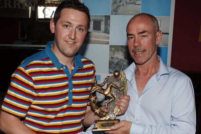 TOP MAN...Nick Boyd, league chairman, presents Colin McClarty, Hazelbank FC, with the Player of the Year award. CR22-299PL