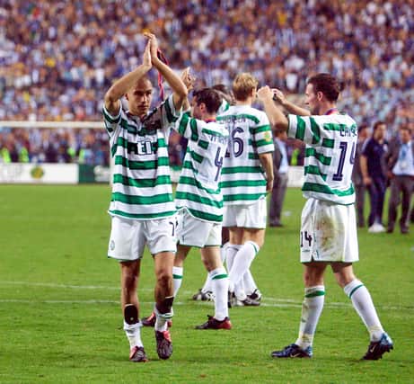 Celtic captain Paul Lambert (right) and Henrik Larsson thank the Celtic fans for their support after their brave performance against came up short in the 3-2 UEFA Cup final defeat in Seville against Porto 18 years ago. (Photo by SNS Group).