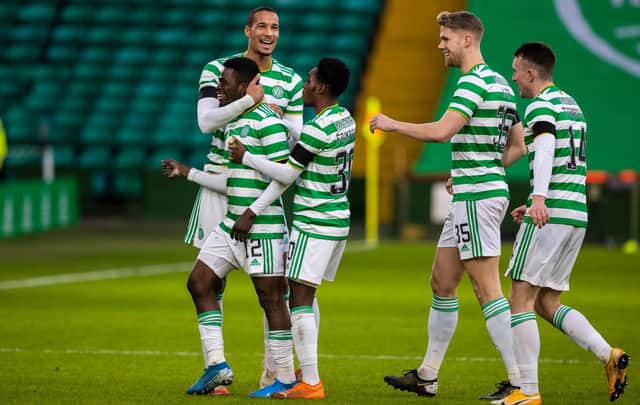 Celtic's Ismaila Soro celebrates his opener and first goal fro the club with Christopher Jullien and Jeremie Frimpong (right) that set Neil Lennon's men on their way to a 3-0 win over Dundee United. (Photo by Craig Williamson / SNS Group)