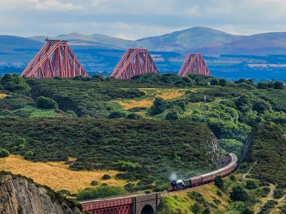 Train routes follow the rugged east coast affording spectacular views. Image: Ryan Edge