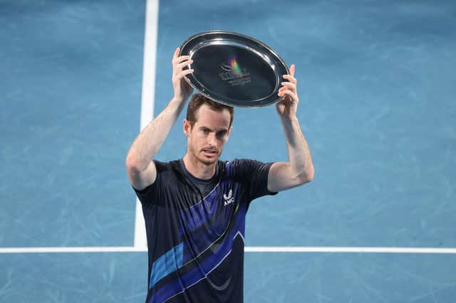 Andy Murray holds the runner's up trophy after losing to Aslan Karatsev at the Sydney Tennis Classic.