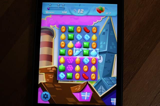 Candy Crush is a favourite form of entertainment for many commuters on public transport (Picture: Joe Raedle/Getty Images)