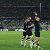 Scotland's Finn Russell, right, acknowledges the supporters after the defeat by Ireland in the Stade de France.  (Photo by FRANCK FIFE/AFP via Getty Images)