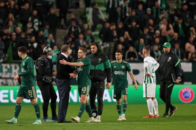 BUDAPEST, HUNGARY - NOVEMBER 04: Celtic manager Ange Postecoglou congratulates his players after they once more found their goal touch on the road in Europe to earn a crucial 3-2 Europa League win away to Ferencvaros. (Photo by Laszlo Szirtesi/Getty Images)