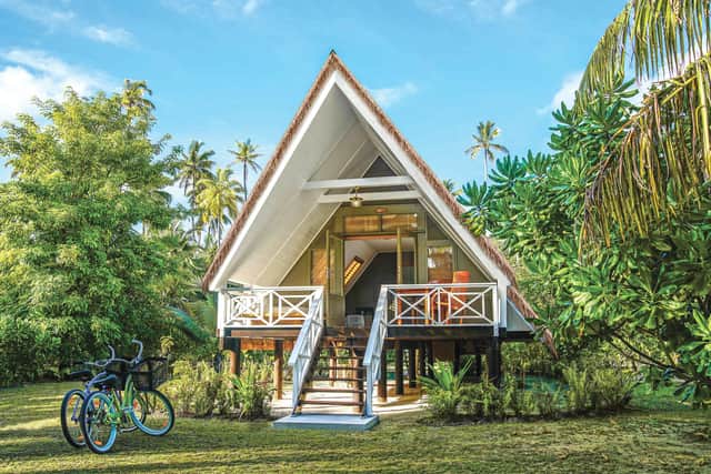 A beach bungalow on Alphonse Island with bicycles out front