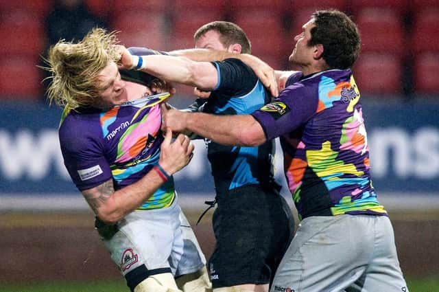 Edinburgh's Scott MacLeod, left, and Glasgow's Chris Fusaro, right, trade blows in the 2010 1872 Cup at Firhill.