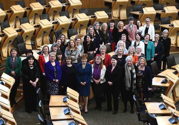Female Scottish MSPs, pictured in 2018, mark the 100th anniversary of women over 30 getting the vote (Picture: Lisa Ferguson)